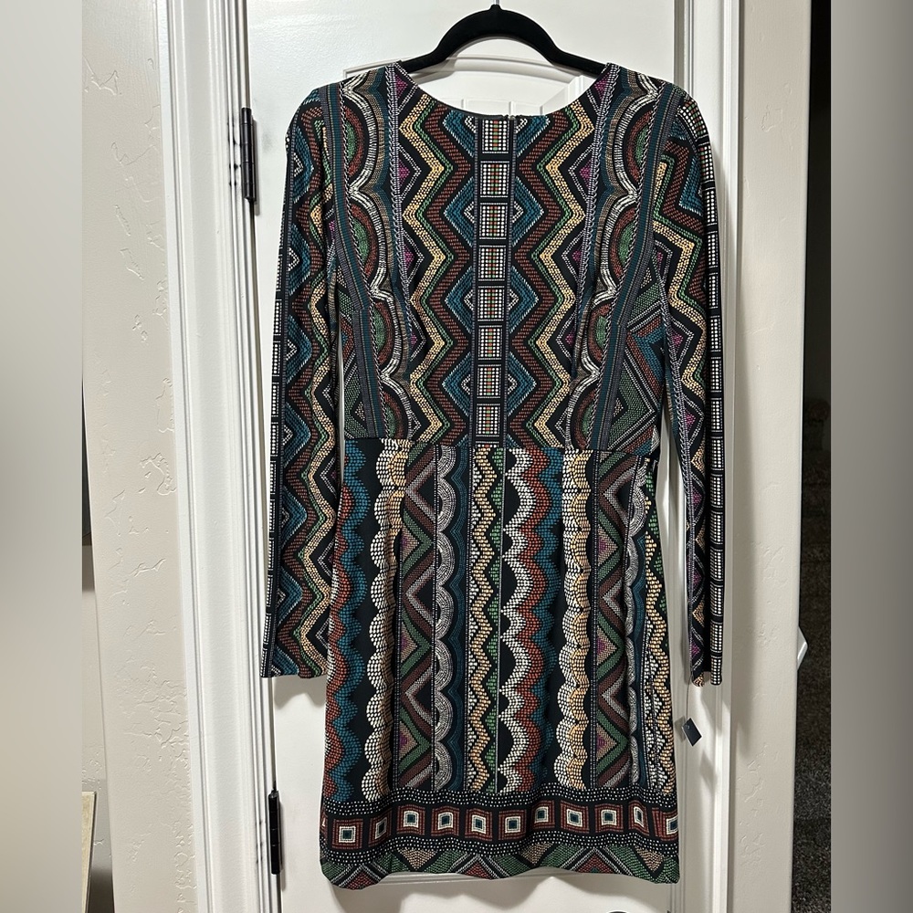 Bought from a boutique. Still has the boutique tag. Never worn. Size 6